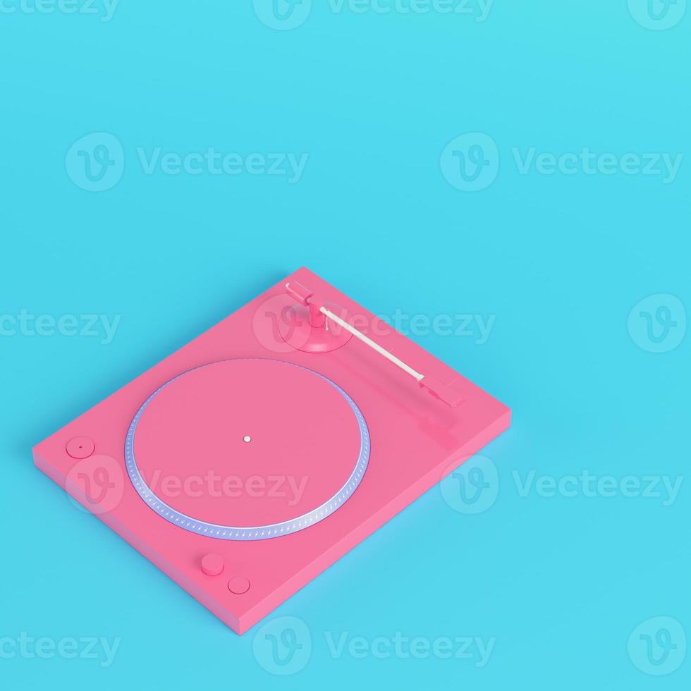 Pink turntable on bright blue background in pastel colors photo