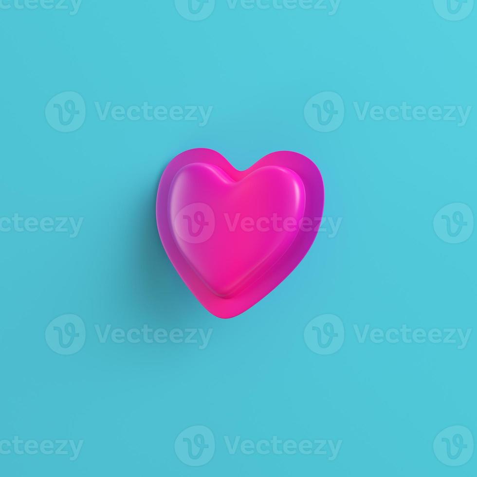 Pink abstract heart on bright blue background photo