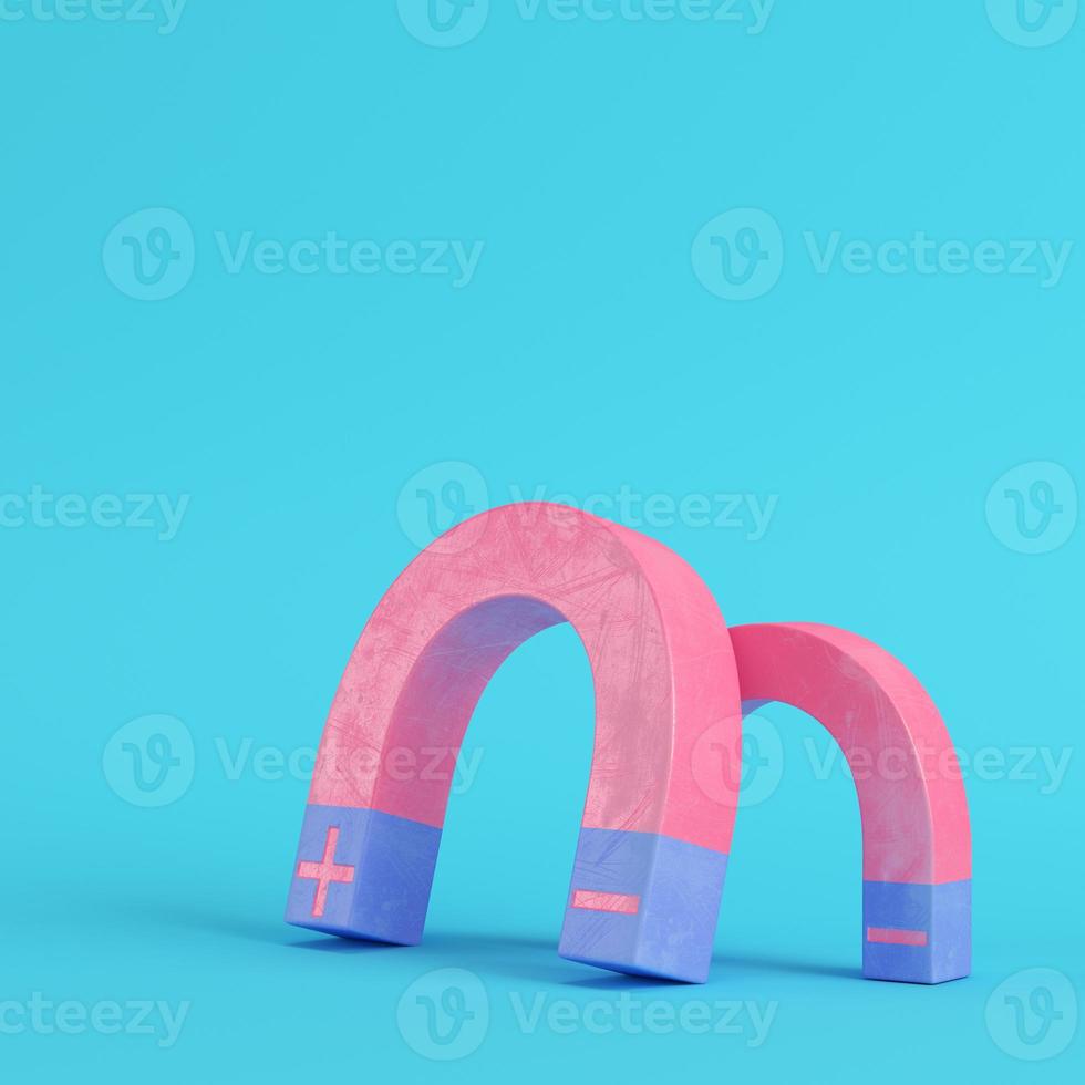 Pink magnets on bright blue background in pastel colors photo
