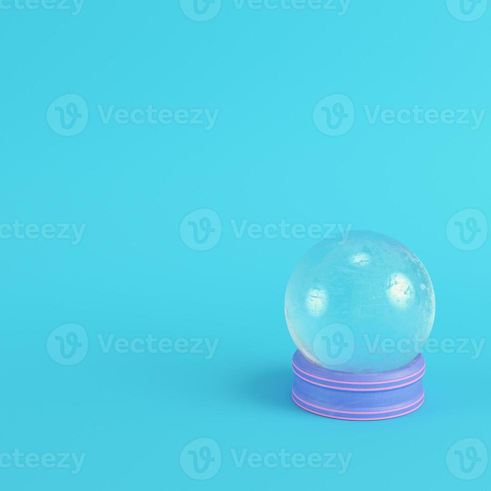 Pink crystal glass with paddles on bright blue background in pastel colors photo