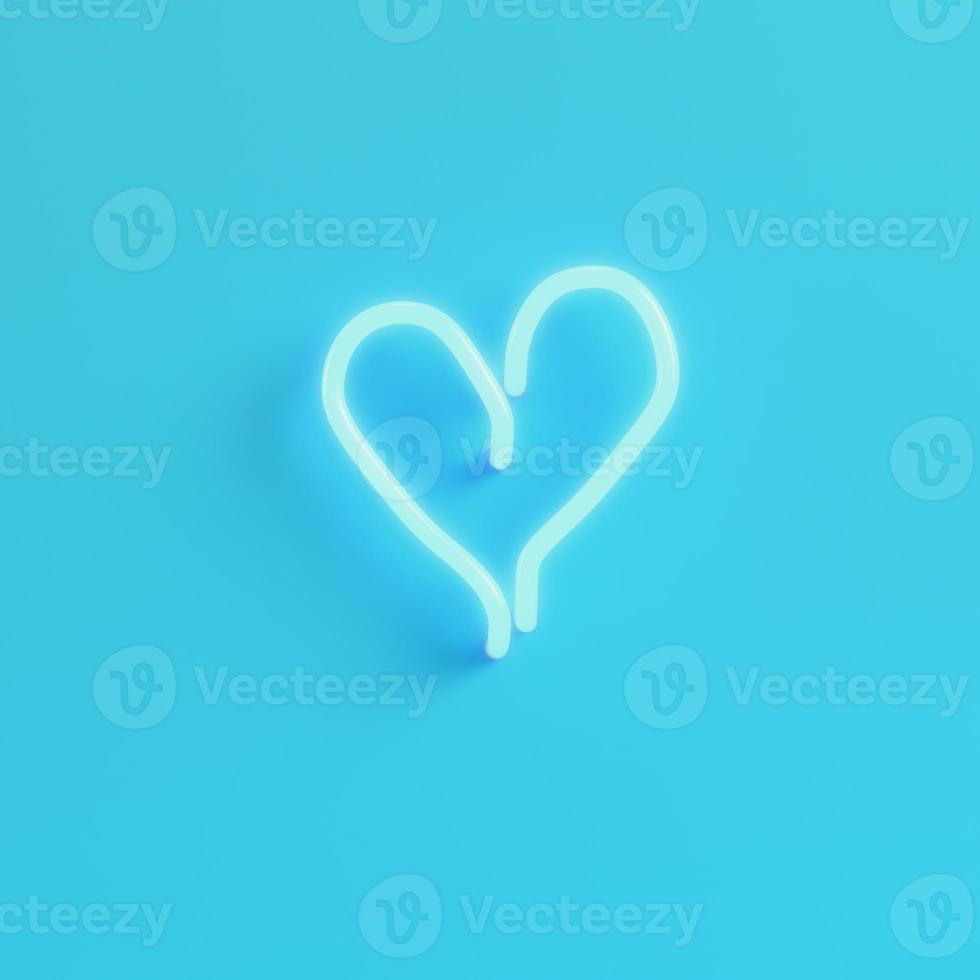 Heart shape neon light on bright blue background in pastel colors photo