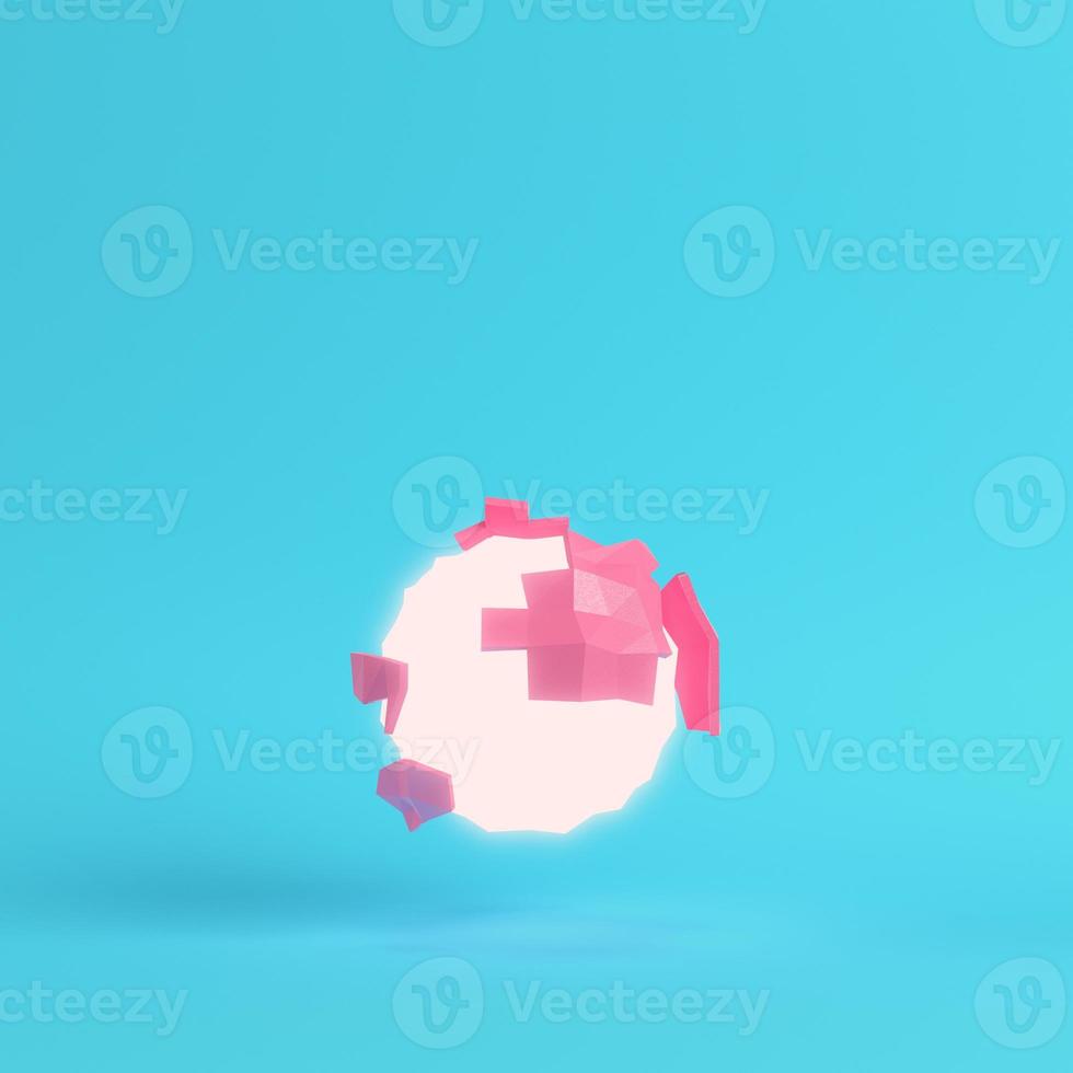 Pink abstract, glowing, low poly planet on bright blue background in pastel colors photo