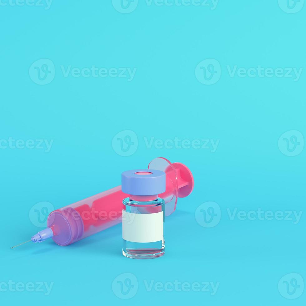 jeringa rosa con vacuna sobre fondo azul brillante en colores pastel foto