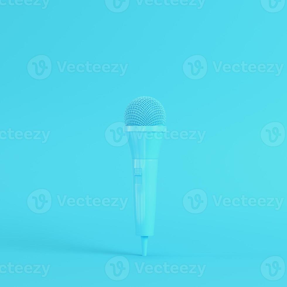 Microphone on bright blue background in pastel colors. Minimalism concept photo