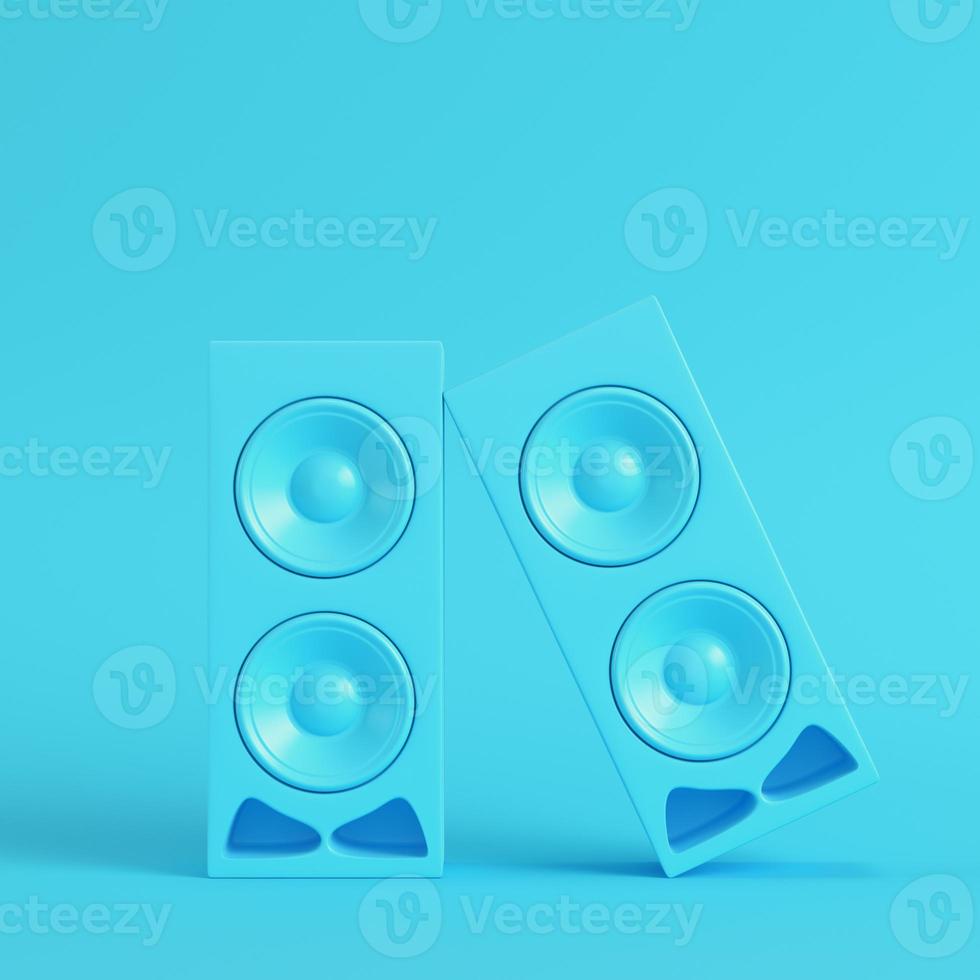 Stereo speakers on bright blue background in pastel colors photo
