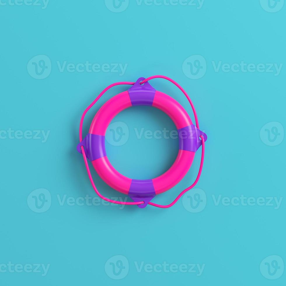 Pink lifebuoy on bright blue background. Minimalism concept photo