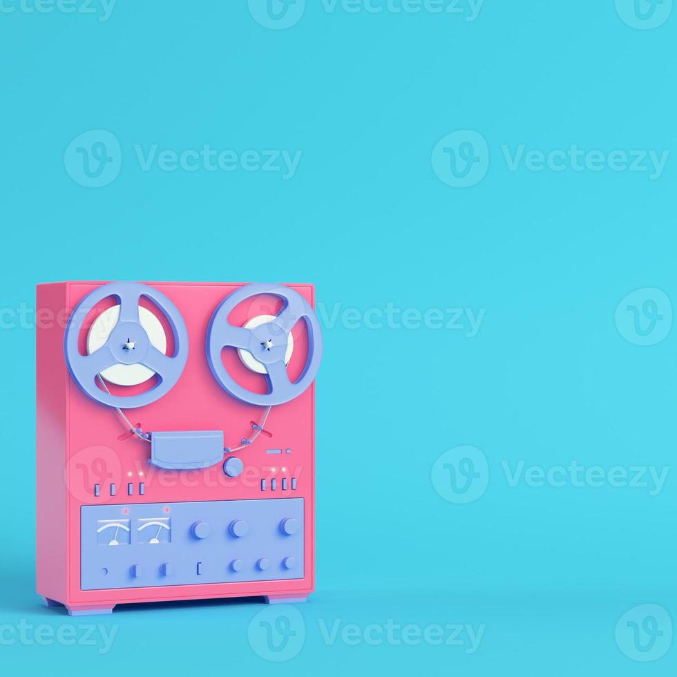 Reel to reel type recorder on bright blue background in pastel colors. Minimalism concept photo