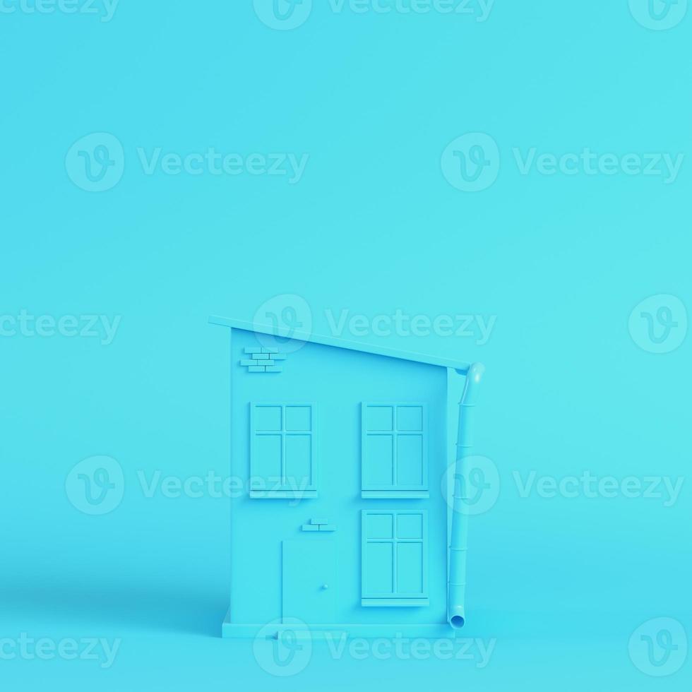 Cartoon styled house on bright blue background in pastel colors photo