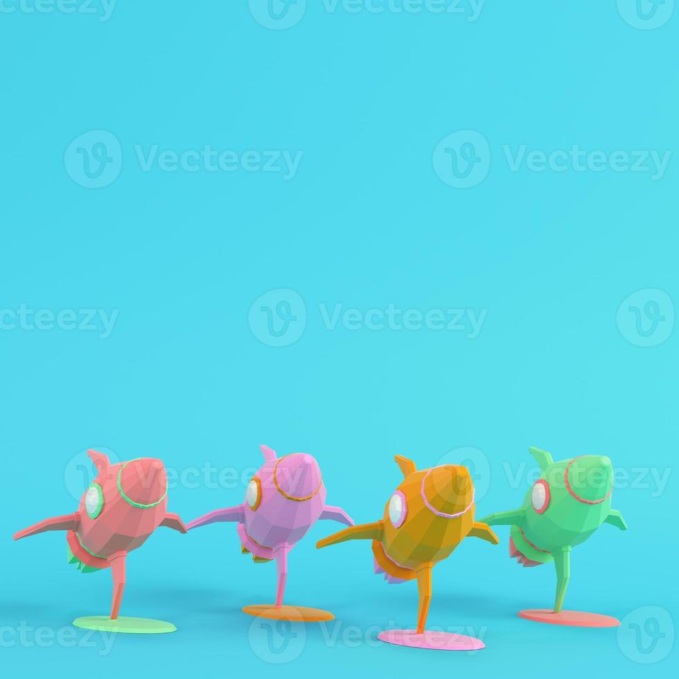 Four colorful toy rockets on bright blue background in pastel colors. Minimalism concept photo