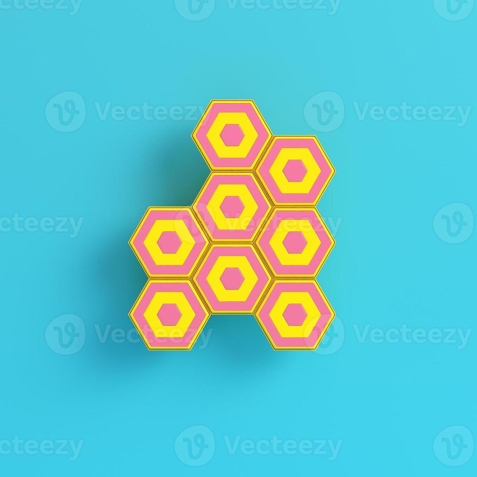 Yellow abstract hexagons on bright blue background in pastel colors. Minimalism concept photo