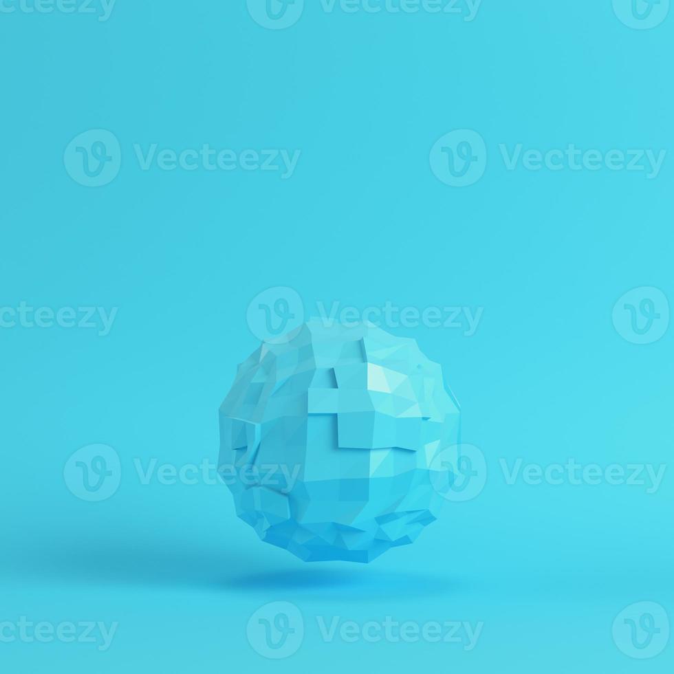 Blue abstract low poly planet on bright blue background in pastel colors. Minimalism concept photo