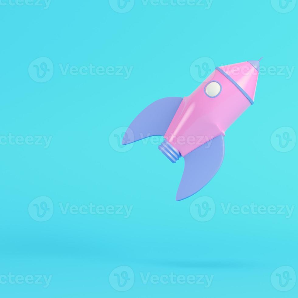 Pink cartoon styled rocket on bright blue background in pastel colors photo