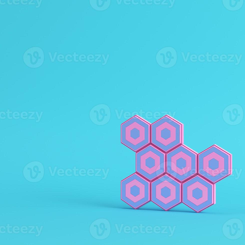 Abstract hexagons with paddles on bright blue background in pastel colors photo