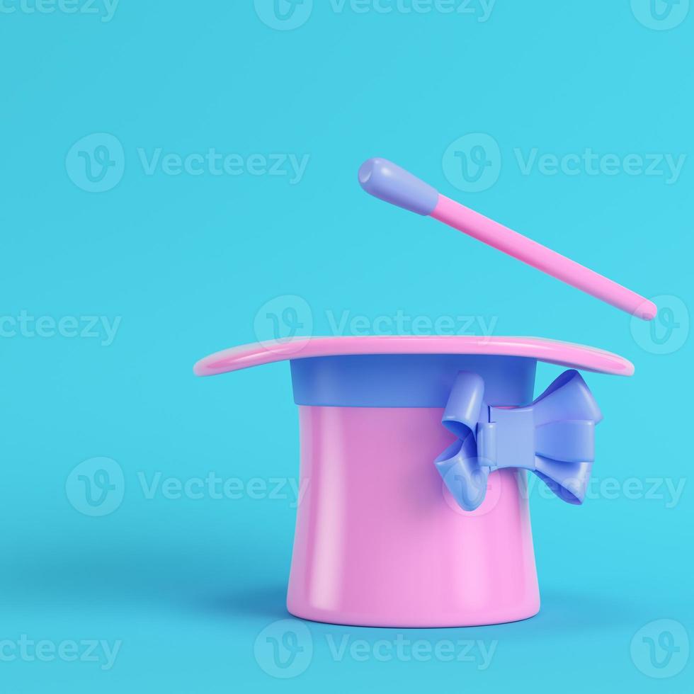 Top hat and magic wand on bright blue background in pastel colors photo