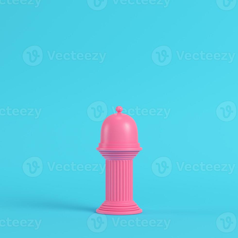 Pink plate with dome on ancient column bright blue background in pastel colors photo