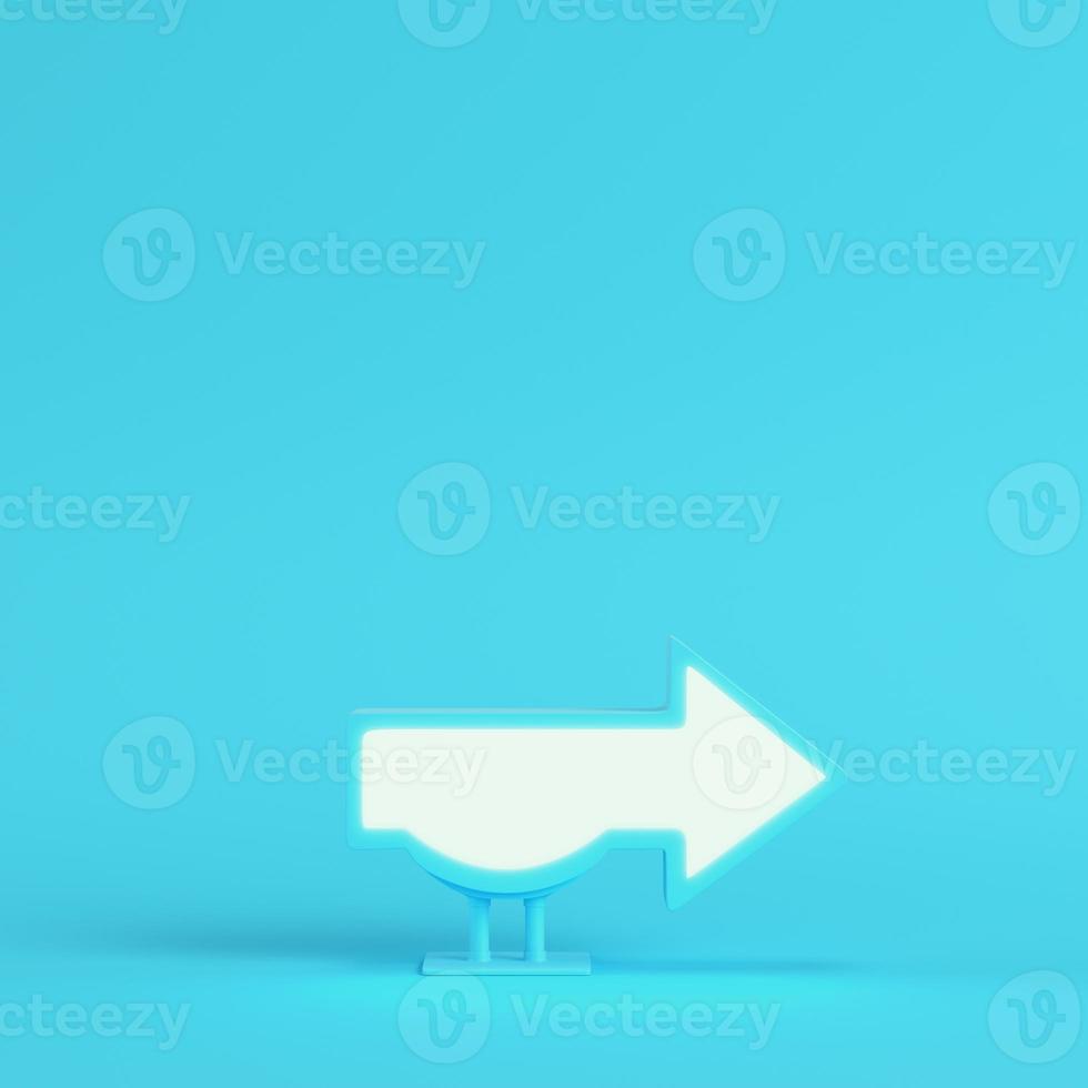 Billboard in arrow shape on bright blue background in pastel colors. Minimalism concept photo