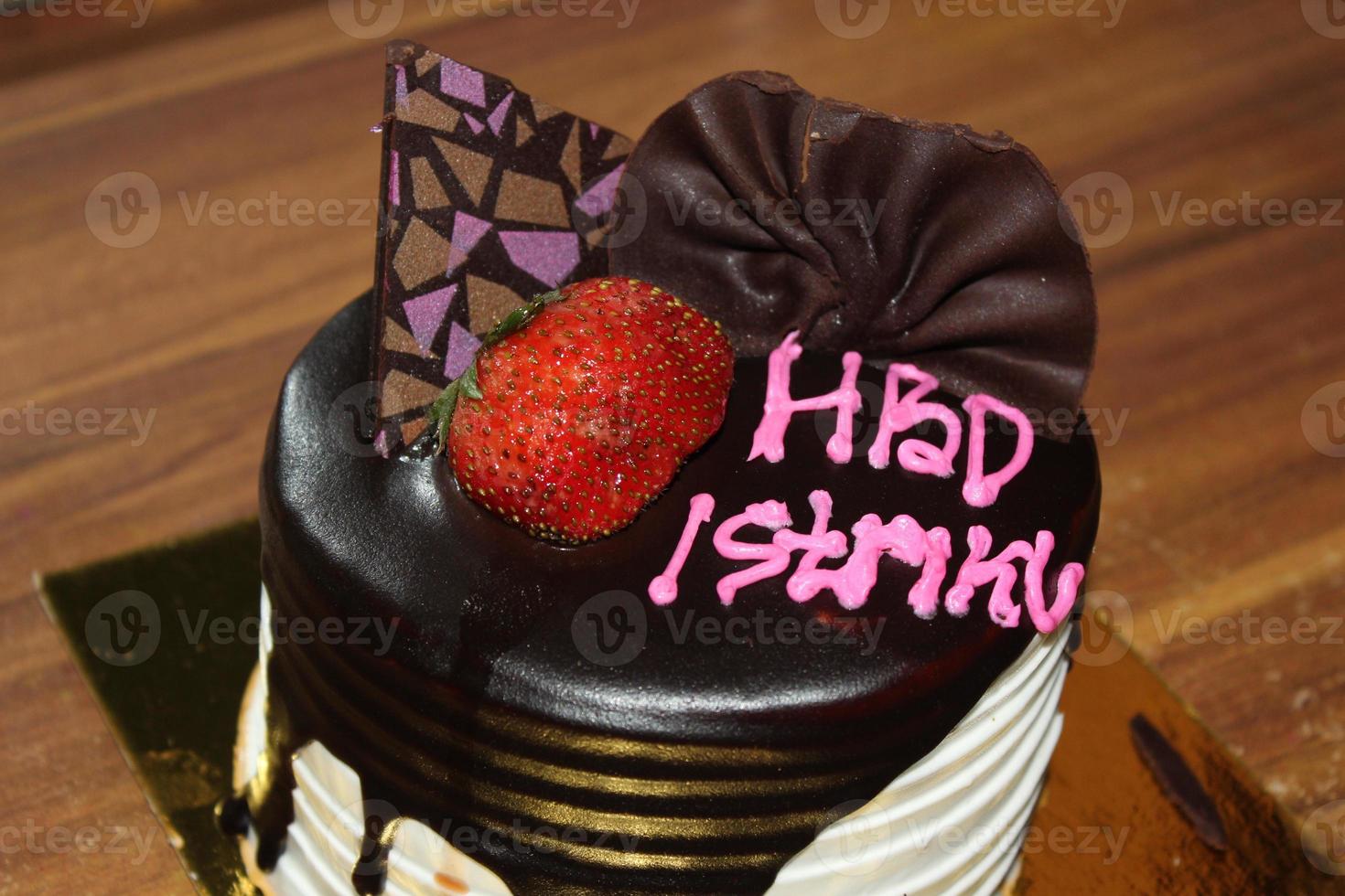 Birthday cake with Indonesian text language HBD Istriku, which means Happy birthday my wife photo