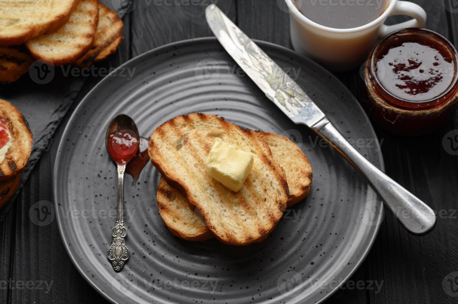 Continental Breakfast meal served with coffee, toast, jam and butter. Delicious coffee table. photo