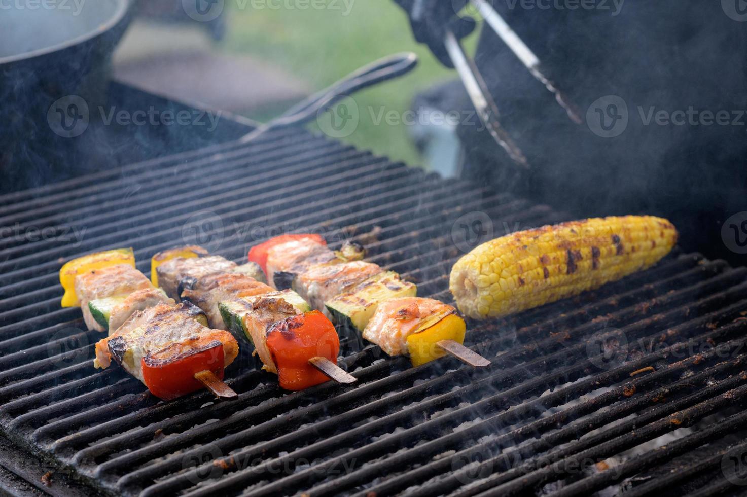 Grilled skewers of salmon and vegetables photo