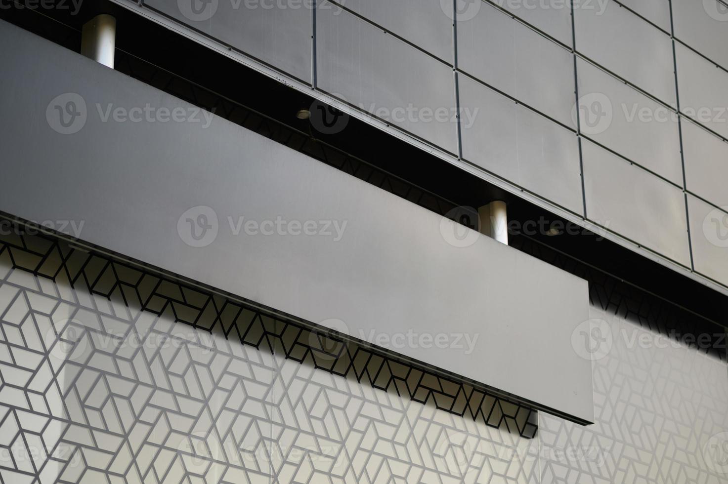Blank black signboard mock up. Empty signage template in modern bright building interior. photo