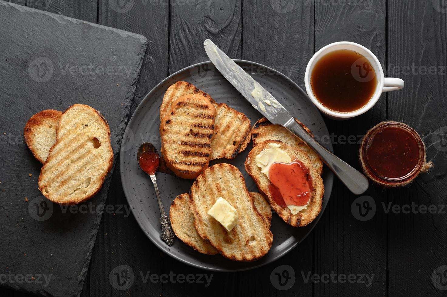 Continental Breakfast meal served with coffee, toast, jam and butter. Delicious coffee table. photo