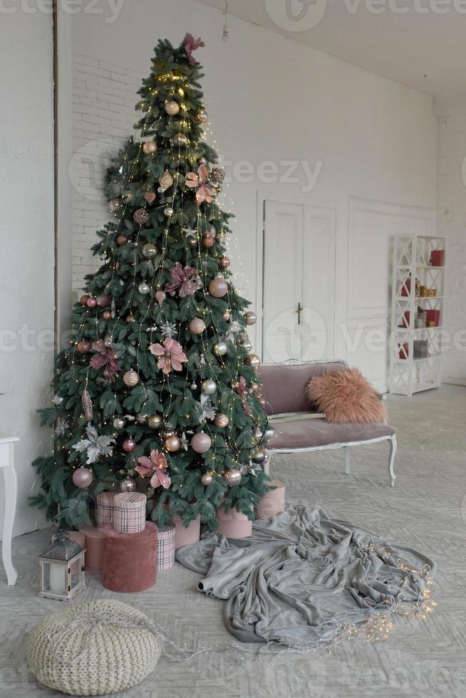 Christmas tree with gifts decor for the new year holiday winter interior room photo