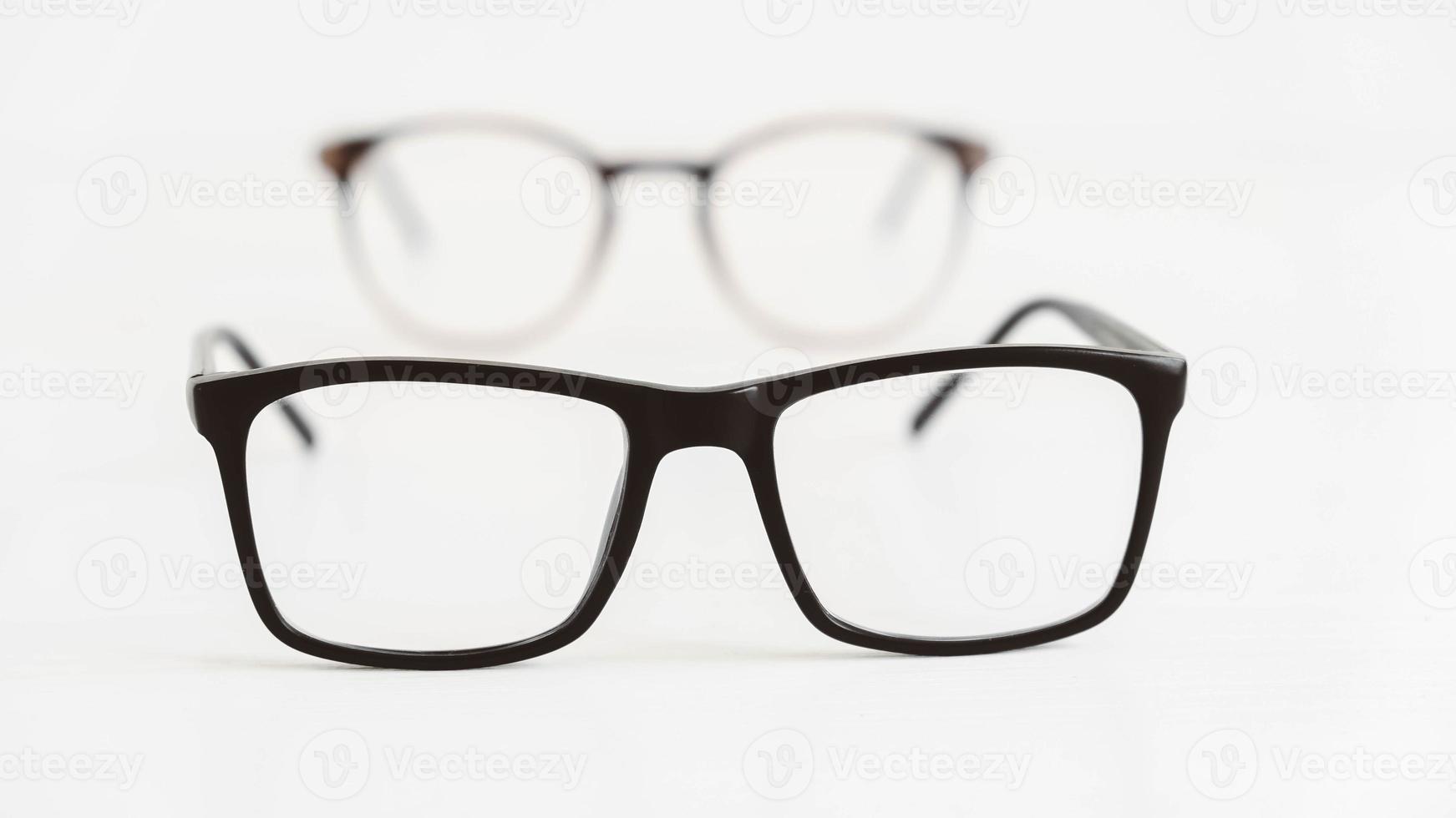 Optical glasses of different shapes on a white background photo