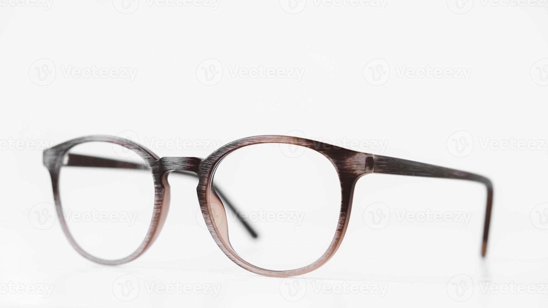Round optical glasses on a white background photo