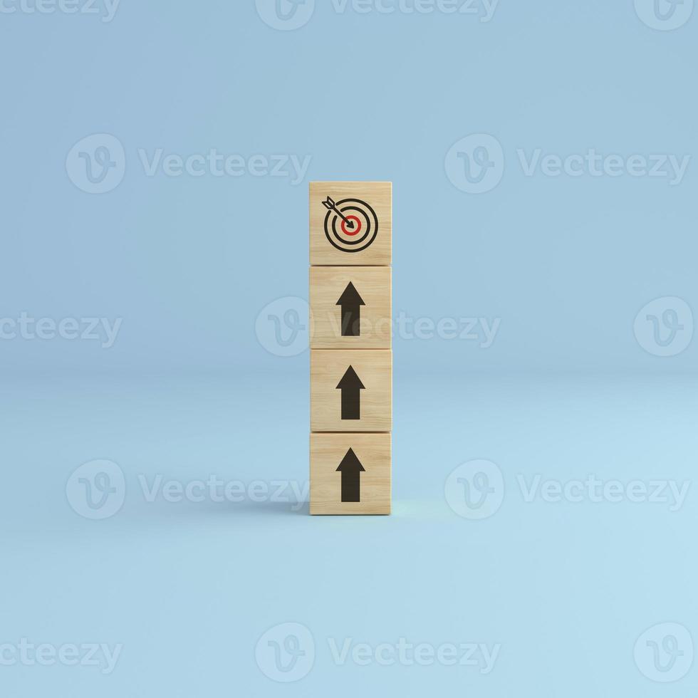 Arrow up with wooden cube blocks tower with target icon on white background. photo
