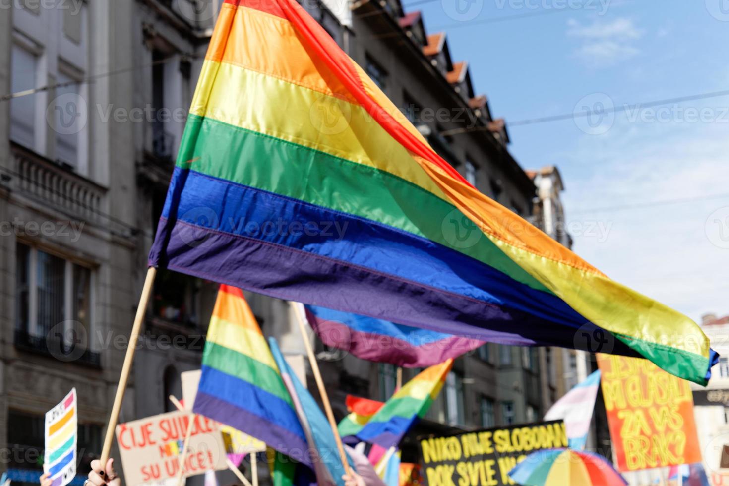 LGBTIQ March Pride. Colorful parade celebrating LGBTIQ rights. Protesters walking with banners and flags. Human rights. Pride, passion and protest. Rainbow families. Equality for all. photo