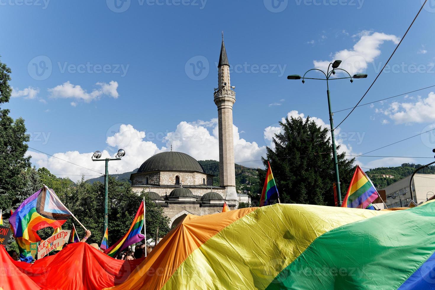 LGBTIQ March Pride. Colorful parade celebrating LGBTIQ rights. Protesters walking with banners and flags. Human rights. Pride, passion and protest. Rainbow families. Equality for all. photo