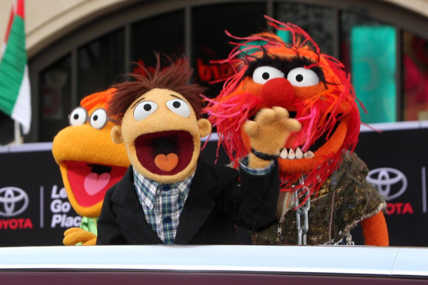 LOS ANGELES, MAR 11 -  Fozzie, Walter, Animal at the Muppets Most Wanted, Los Angeles Premiere at the El Capitan Theater on March 11, 2014 in Los Angeles, CA photo