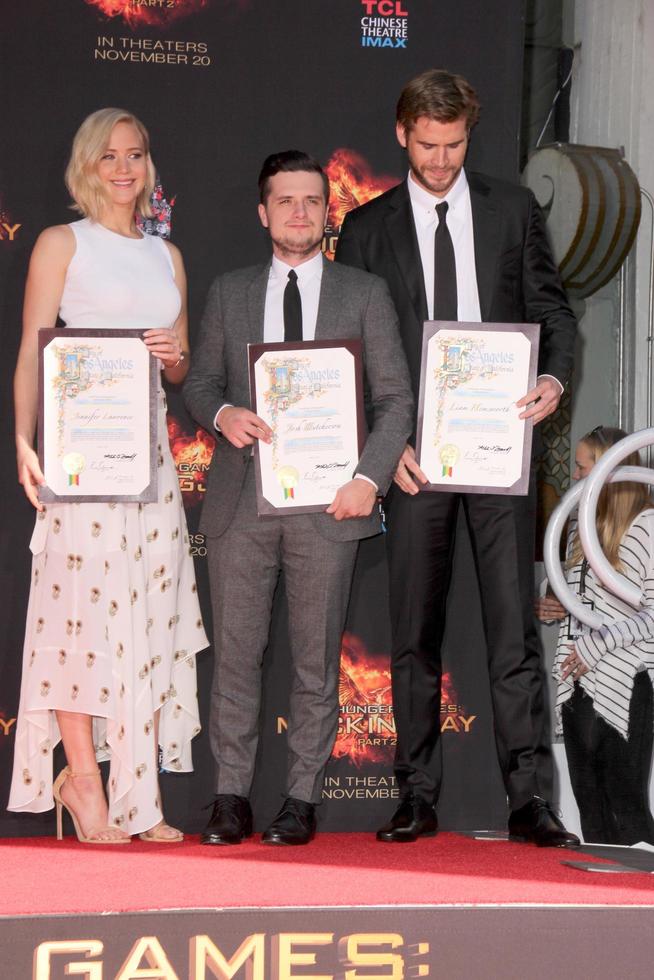 LOS ANGELES, OCT 31 -  Josh Hutcherson, Jennifer Lawrence, Liam Hemsworth at the Hunger Games Handprint and Footprint Ceremony at the TCL Chinese Theater on October 31, 2015 in Los Angeles, CA photo