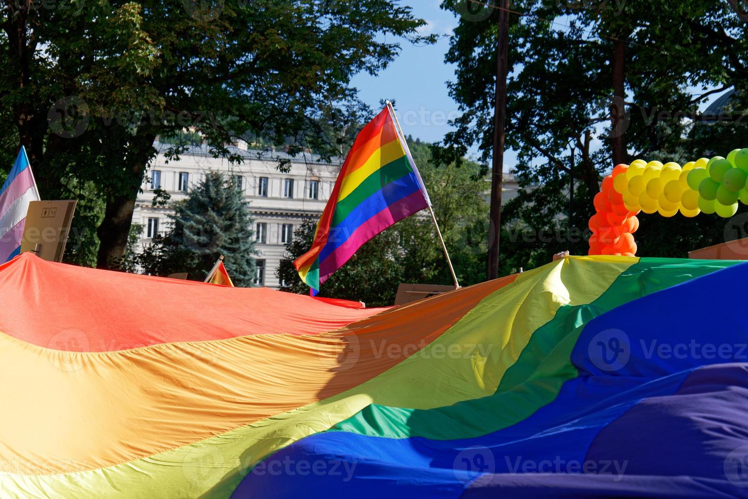 LGBTIQ March Pride. Colorful parade celebrating LGBTIQ rights. Protesters walking with banners and flags. Human rights. Pride, passion and protest. Rainbow families. Equality for all. photo