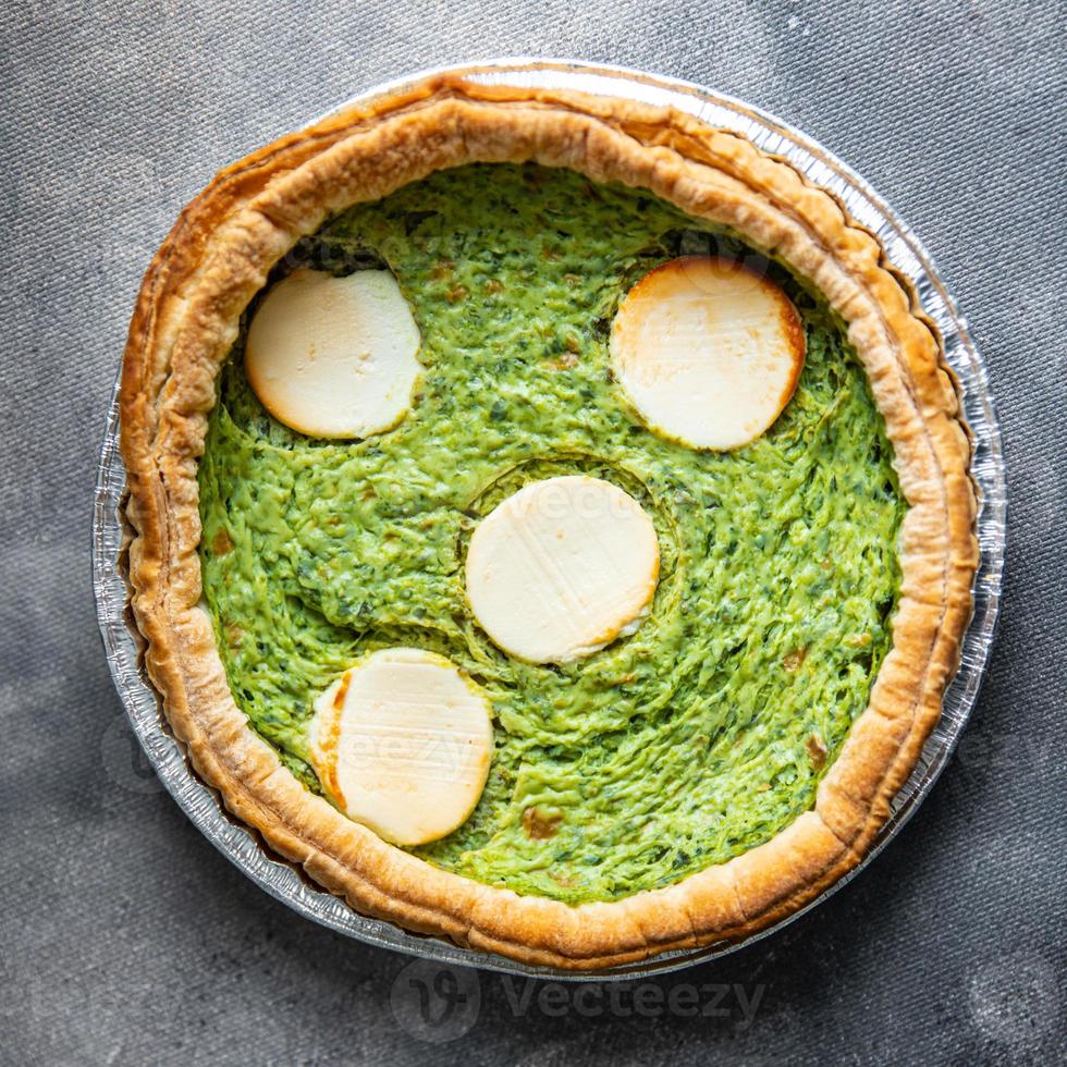 green savory pie spinach tart cheese fresh healthy meal food snack on the table copy space food background photo