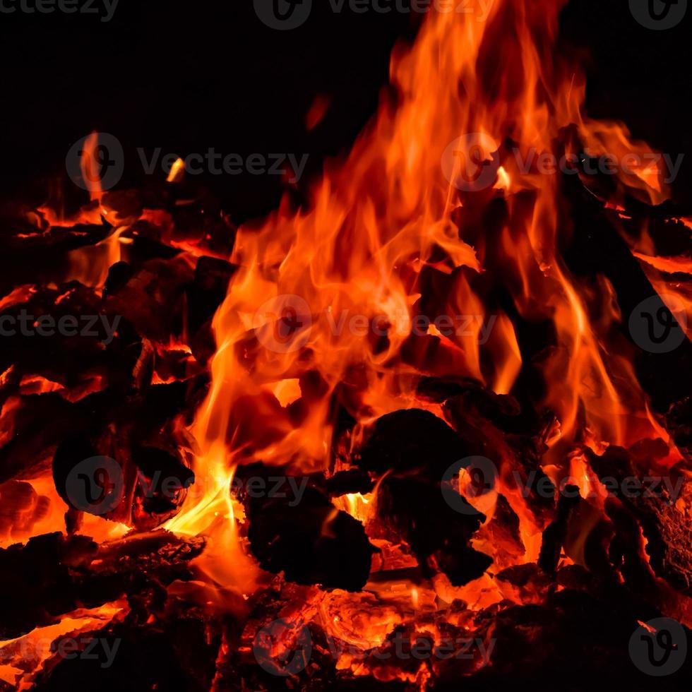 Fire flames on black background, Blaze fire flame texture background, Beautifully, the fire is burning, Fire flames with wood and cow dung bonfire photo