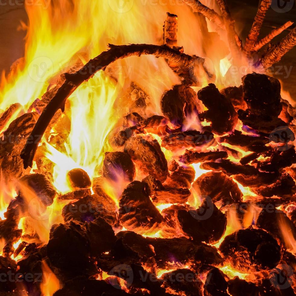 Fire flames on black background, Blaze fire flame texture background, Beautifully, the fire is burning, Fire flames with wood and cow dung bonfire photo