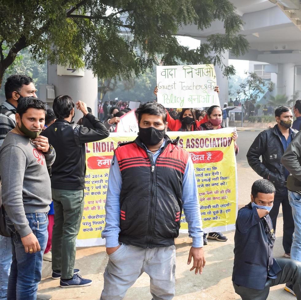 New Delhi, India December 25 2021 - Delhi Contractual Guest Teachers with posters, flags and graffitis protesting against Delhi AAP Government for making policy, Delhi Guest Teachers protesting photo