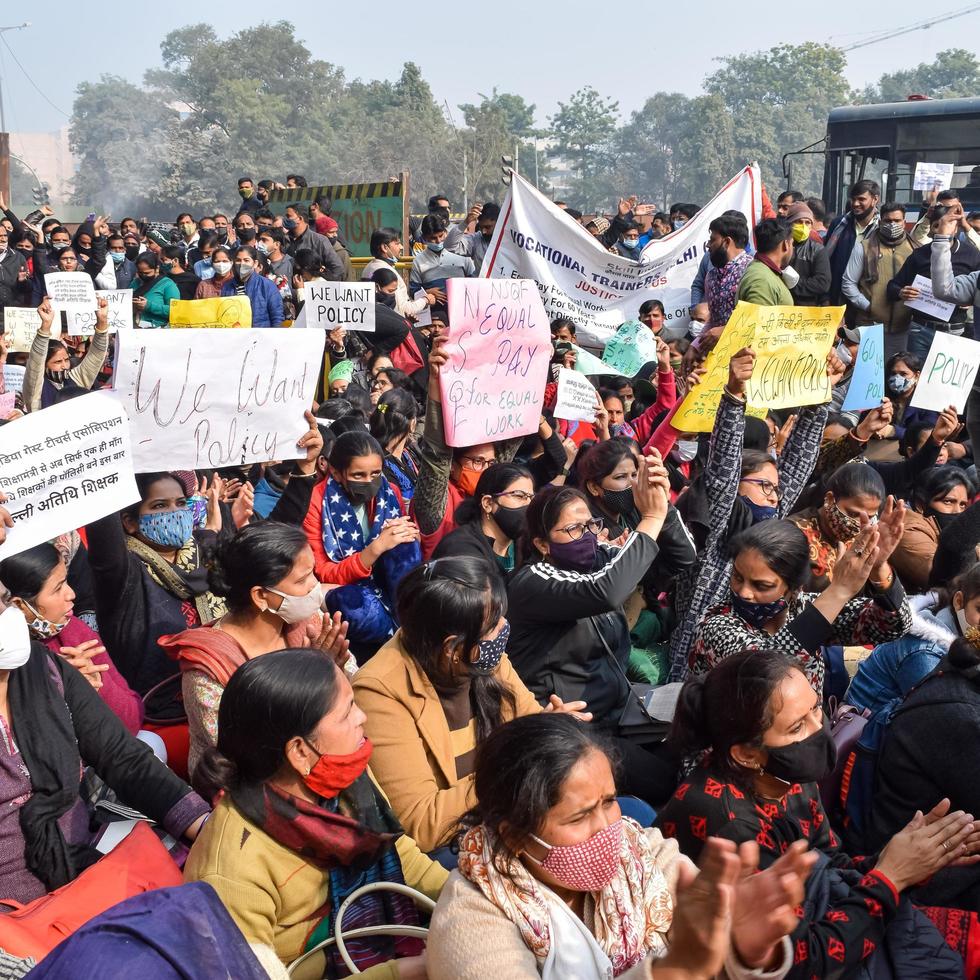 New Delhi, India December 25 2021 - Delhi Contractual Guest Teachers with posters, flags and graffitis protesting against Delhi AAP Government for making policy, Delhi Guest Teachers protesting photo