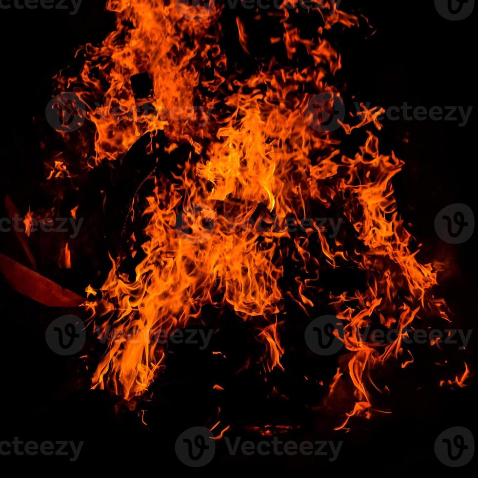 Fire flames on black background, Blaze fire flame texture background, Beautifully, the fire is burning, Fire flames with wood and cow dung bonfire photo