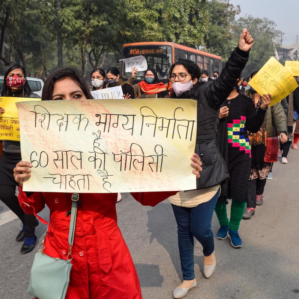 New Delhi, India December 25 2021 - Delhi Contractual Guest Teachers with posters, flags and graffitis protesting against Delhi AAP Government for making policy, Delhi Guest Teachers protesting photo