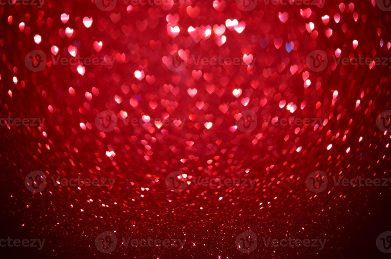 Red Blur heart shape of ligth bokeh on a black background photo