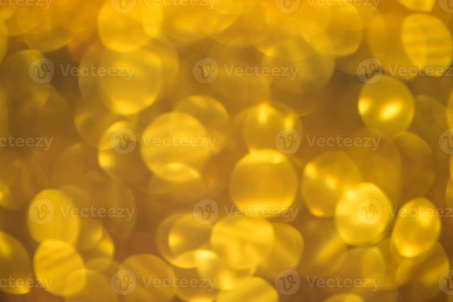 Golden glitter bokeh lighting texture Blurred abstract background for birthday, anniversary, wedding, new year eve or Christmas photo