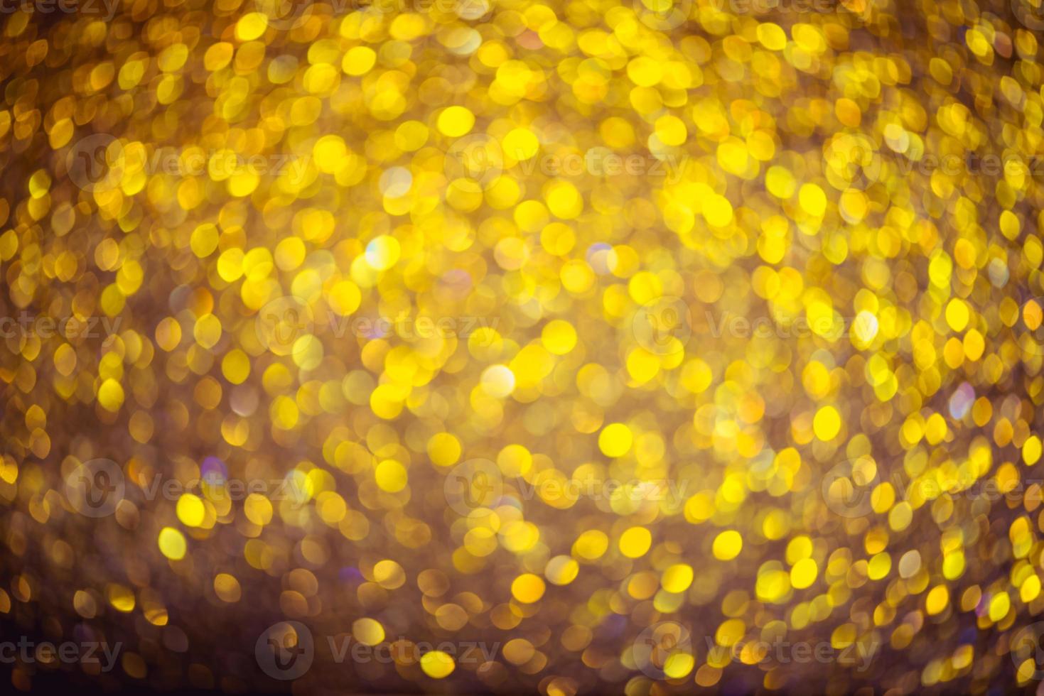 Golden glitter bokeh lighting texture Blurred abstract background for birthday, anniversary, wedding, new year eve or Christmas photo