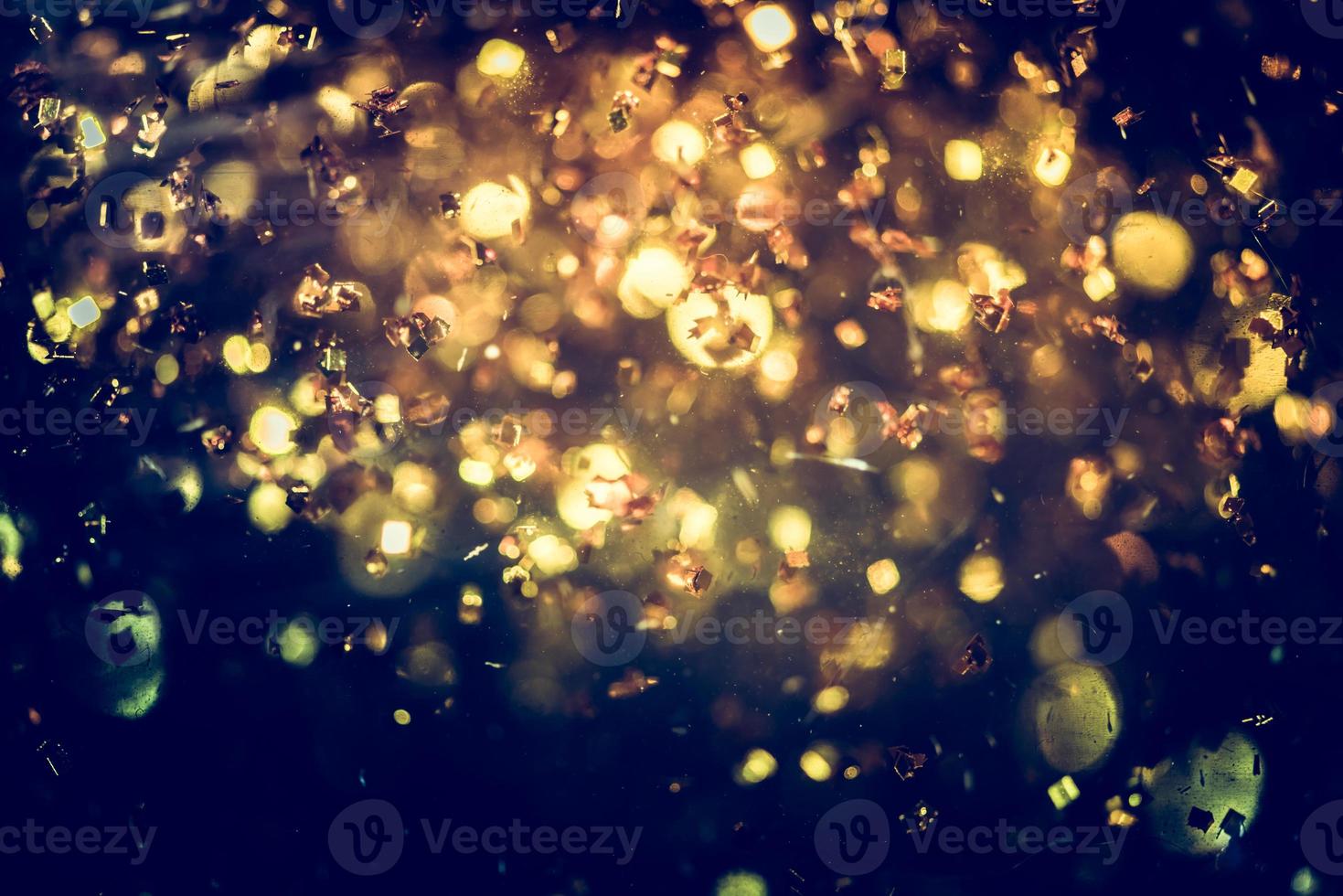 Golden glitter bokeh lighting texture Blurred abstract background for birthday, anniversary, wedding, new year eve or Christmas photo