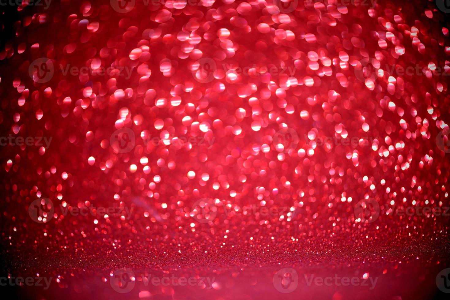Red Blur heart shape of ligth bokeh on a black background photo
