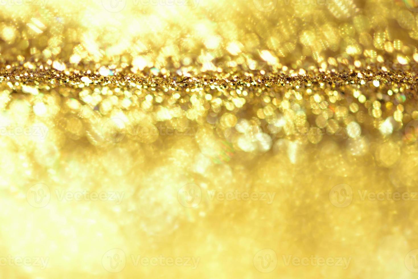 Golden glitter bokeh lighting texture Blurred abstract background for birthday, anniversary, wedding, new year eve or Christmas photo