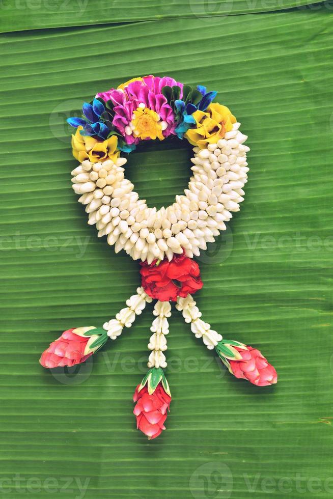 Thai traditional jasmine garland.symbol of Mother's day in thailand on Banana leaf photo