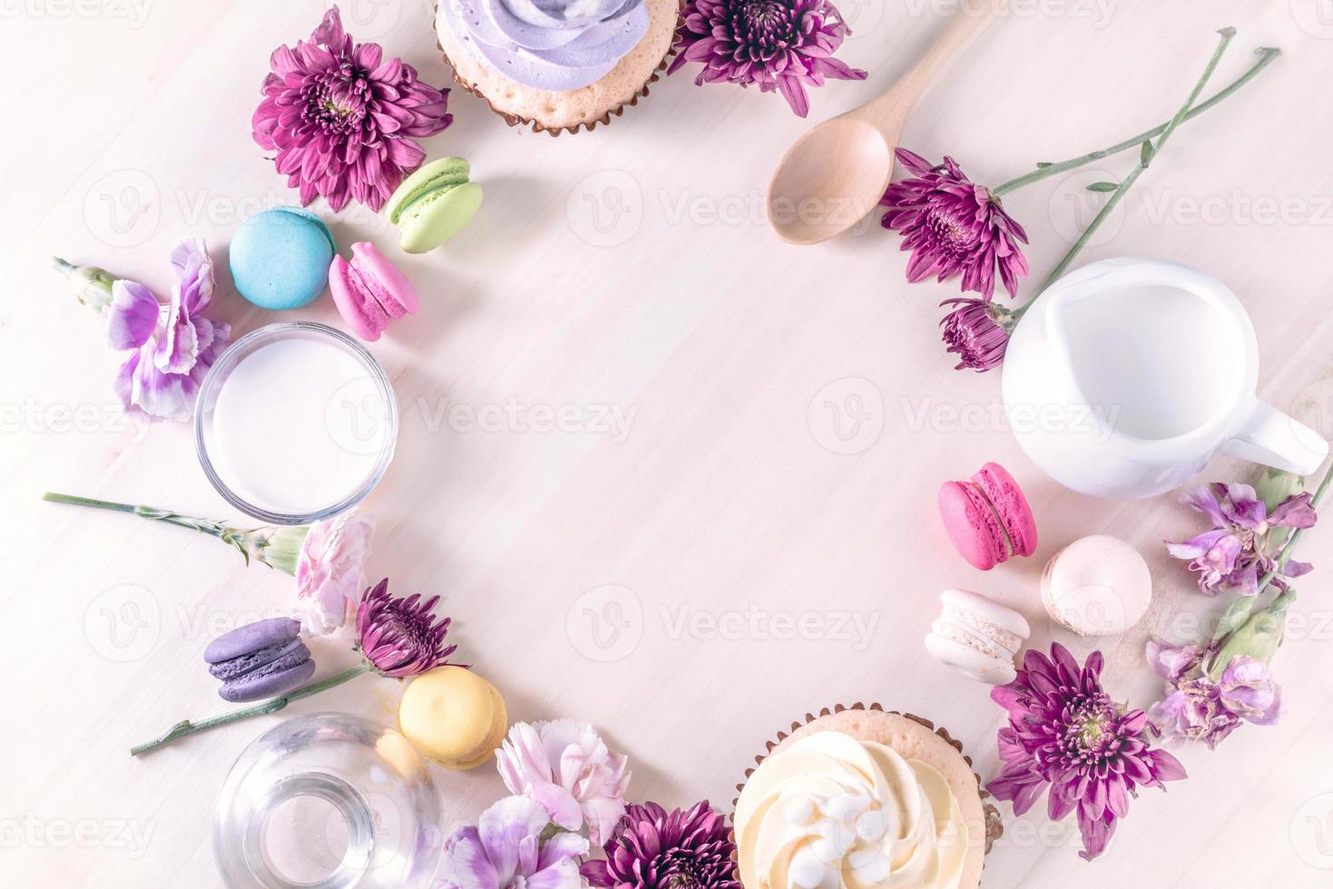 macarons or macaroons and cupcakes with milk on a vintage pastel color dessert sweet beautiful to eat photo