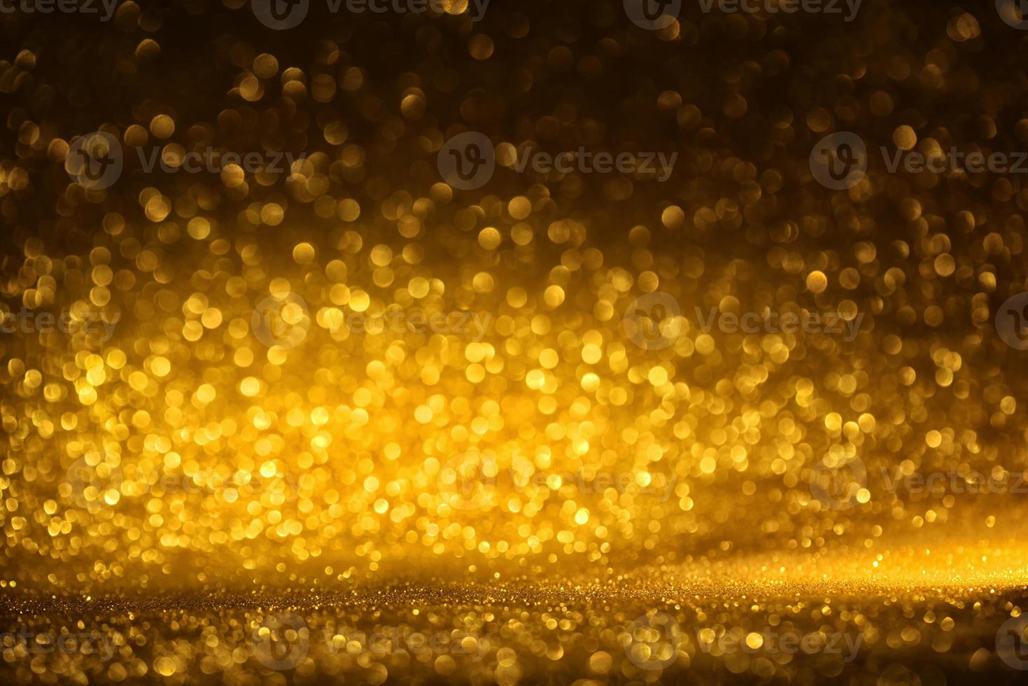 Golden glitter bokeh lighting texture Blurred abstract background for birthday, anniversary, wedding, new year eve or Christmas photo